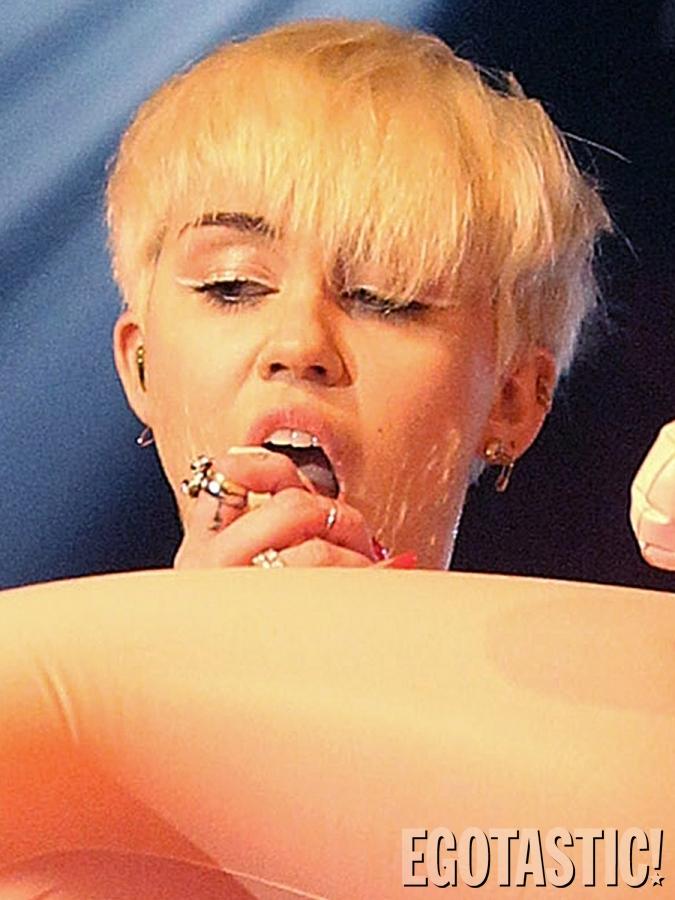 Miley Cyrus Gives an Oral Treat to a Blow Up Doll on Stage in